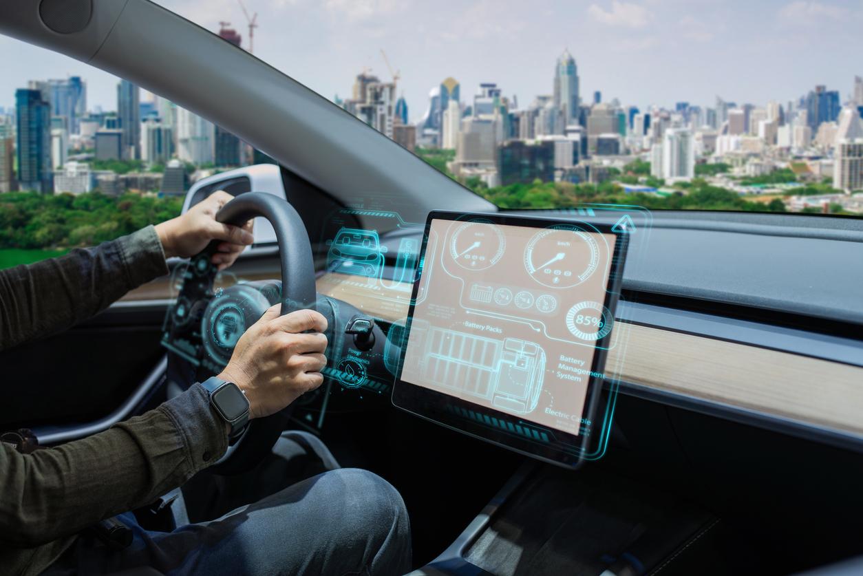 Driver Using Electric Car with Futuristic Dashboard stock photo